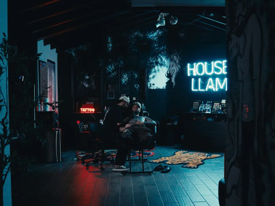 Tattoo session inside House en Llamas studio in Miami